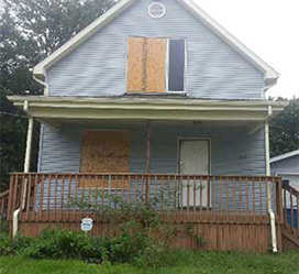 A house with boarded up windows
